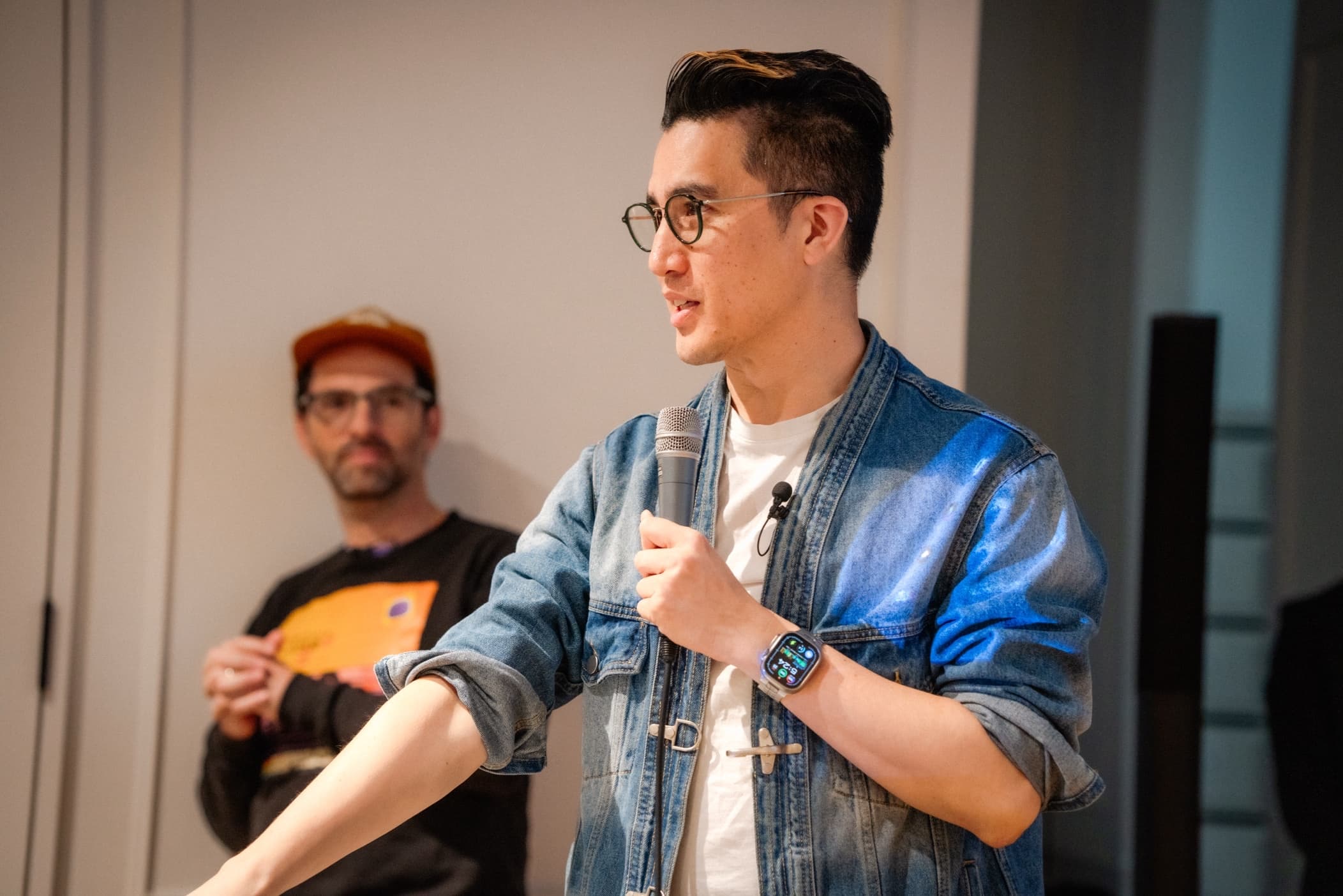 Presenter speaking at GenJam event